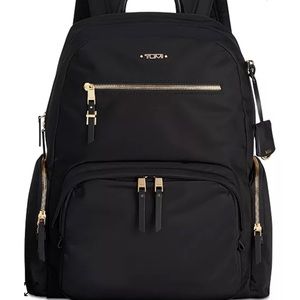 Tumi black & gold backpack with laptop zip compartment. No serial number